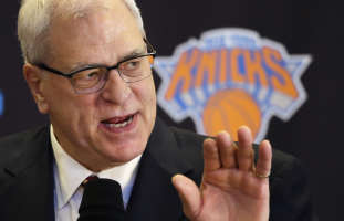 Phil Jackson, the new president of the New York Knicks, answers questions during a news conference, Tuesday, March 18, 2014 in New York. Jackson, who won...